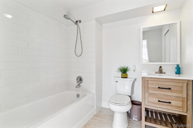 7158 W Roxbury Ave, Littleton, CO 80128 - bathroom featuring toilet, vanity, and bathing tub / shower combination