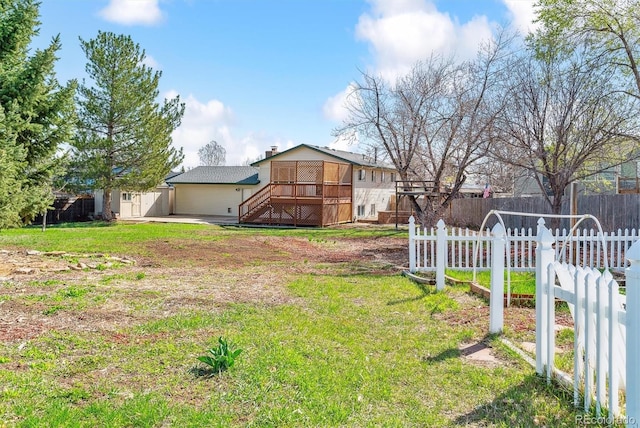 7158 W Roxbury Ave, Littleton, CO 80128 - view of yard featuring a wooden deck, fence private yard, and stairway