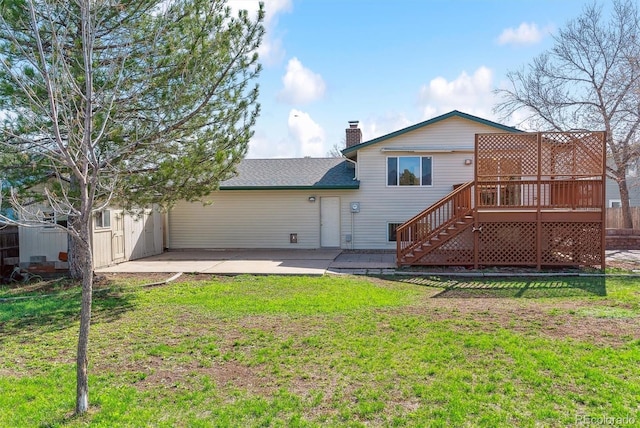 7158 W Roxbury Ave, Littleton, CO 80128 - back of house with stairway, a chimney, a patio area, a lawn, and a deck
