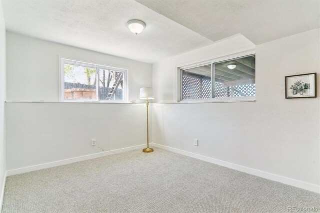 7158 W Roxbury Ave, Littleton, CO 80128 - carpeted empty room featuring a textured ceiling and baseboards