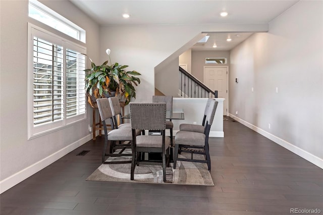 4504 N Picadilly Ct, Aurora, CO 80019 - dining space featuring wood finished floors, stairway, and recessed lighting
