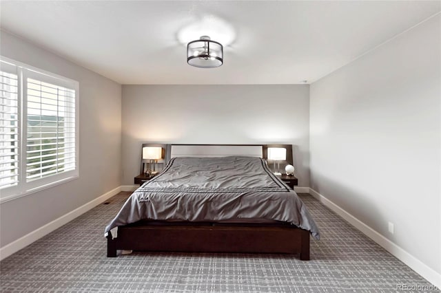 4504 N Picadilly Ct, Aurora, CO 80019 - carpeted bedroom featuring baseboards