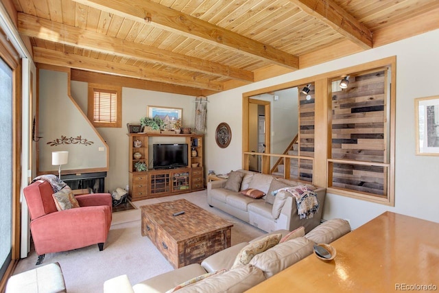 living room featuring stairs, beam ceiling, wooden ceiling, and light carpet