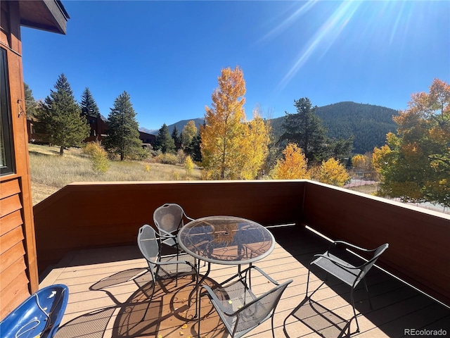 wooden terrace with a mountain view
