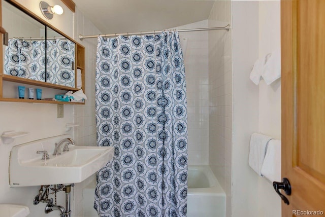 full bathroom featuring shower / bath combo and a sink