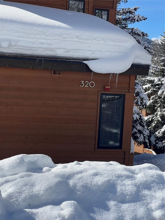view of snow covered property