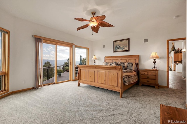 13954 Pine Country Ln, Conifer, CO 80433 - bedroom featuring access to exterior, light carpet, and ceiling fan