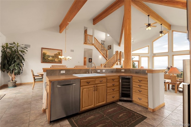 13954 Pine Country Ln, Conifer, CO 80433 - kitchen featuring wine cooler, stainless steel dishwasher, ceiling fan, beamed ceiling, and high vaulted ceiling