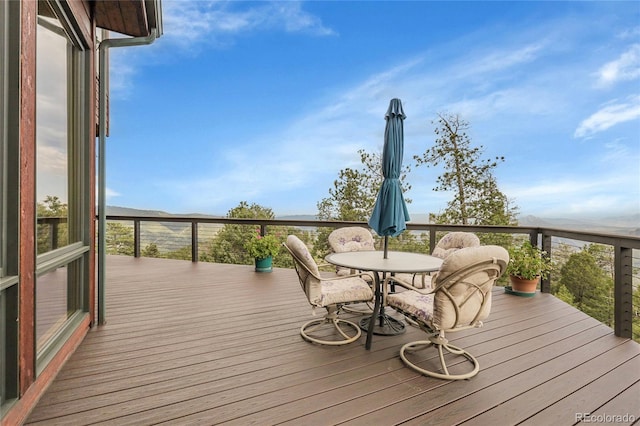 13954 Pine Country Ln, Conifer, CO 80433 - wooden terrace featuring outdoor dining space
