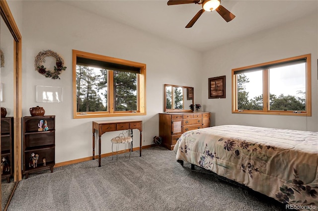 13954 Pine Country Ln, Conifer, CO 80433 - carpeted bedroom featuring multiple windows and a ceiling fan