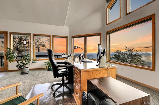13954 Pine Country Ln, Conifer, CO 80433 - home office with carpet flooring, healthy amount of natural light, and high vaulted ceiling