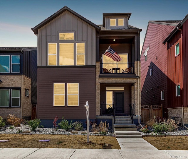 16762 Tejon Ln, Broomfield, CO 80023 - contemporary home featuring a balcony and board and batten siding