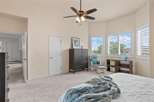 16862 W 65th Cir, Arvada, CO 80007 - bedroom featuring light carpet, multiple windows, and ceiling fan