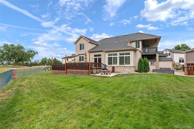 16862 W 65th Cir, Arvada, CO 80007 - rear view of house featuring stucco siding, a fenced backyard, a patio area, and a shingled roof