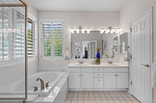 16862 W 65th Cir, Arvada, CO 80007 - bathroom featuring double vanity, a bath, and tile patterned floors