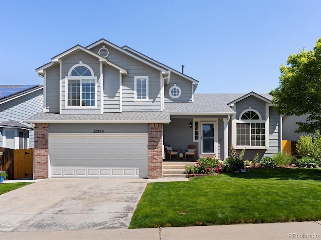 20789 E Princeton Pl, Aurora, CO 80013 - view of front of house with brick siding, covered porch, an attached garage, concrete driveway, and a shingled roof