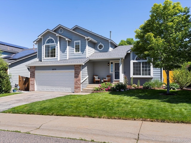20789 E Princeton Pl, Aurora, CO 80013 - view of front of property with brick siding, concrete driveway, an attached garage, and roof with shingles
