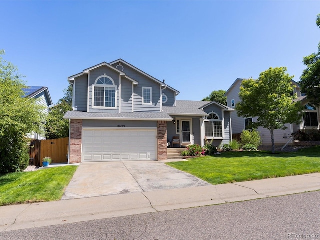 20789 E Princeton Pl, Aurora, CO 80013 - view of front of home featuring brick siding, driveway, and a garage