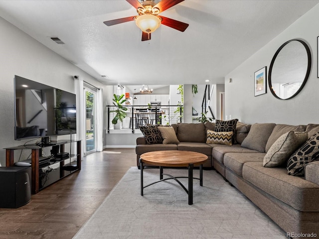20789 E Princeton Pl, Aurora, CO 80013 - living area featuring light wood-style flooring, a chandelier, and ceiling fan
