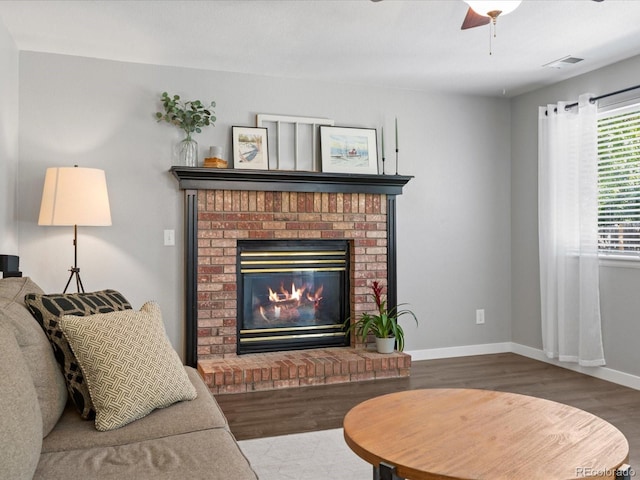 20789 E Princeton Pl, Aurora, CO 80013 - living area featuring wood finished floors, a fireplace, and baseboards