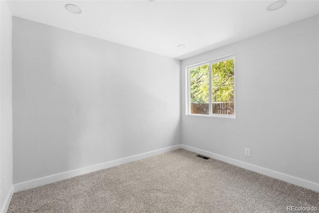 spare room with carpet floors