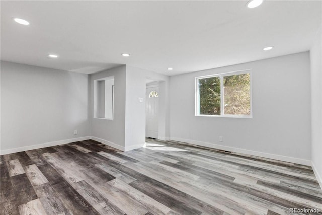 empty room featuring hardwood / wood-style flooring