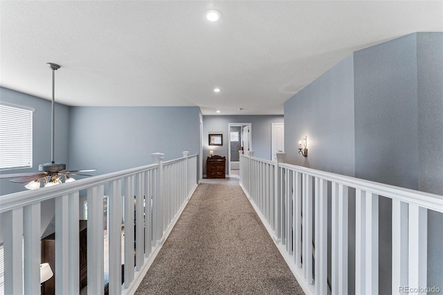 corridor with light colored carpet