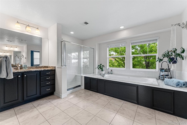 bathroom featuring vanity, tile patterned floors, and independent shower and bath