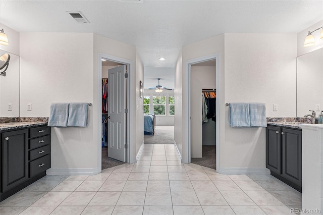 bathroom featuring vanity, tile patterned floors, and ceiling fan