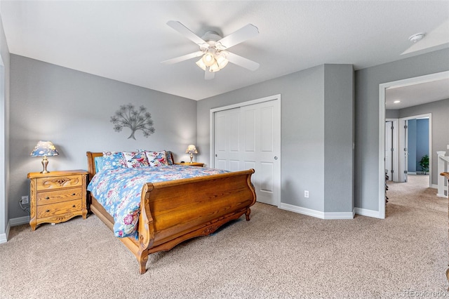 bedroom featuring carpet floors, a closet, and ceiling fan