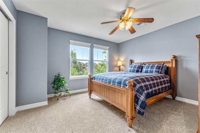 bedroom featuring ceiling fan and carpet flooring