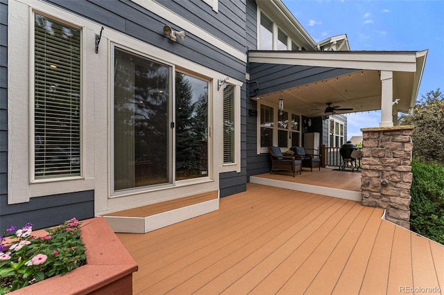 wooden deck with ceiling fan and a porch