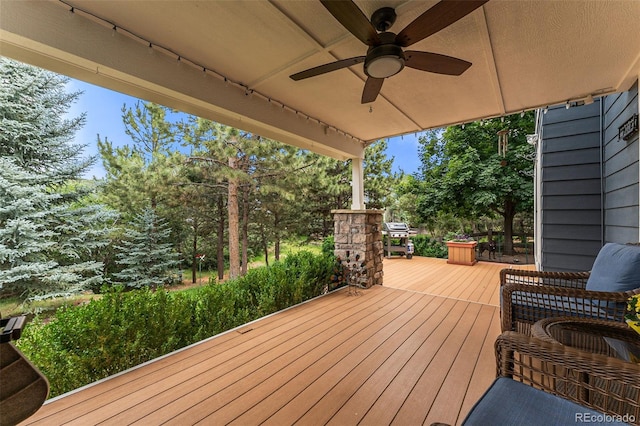 wooden deck with ceiling fan