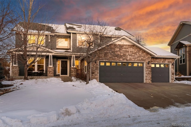 view of front facade featuring a porch and a garage