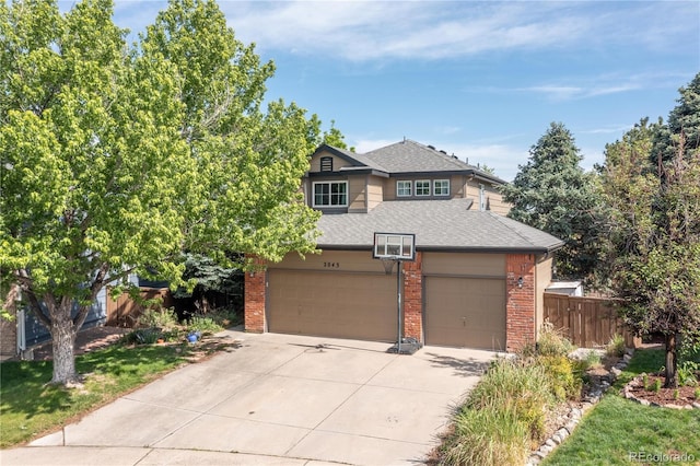 2043 Fendlebrush St, Highlands Ranch, CO 80129 - view of front facade featuring brick siding, roof with shingles, driveway, and an attached garage