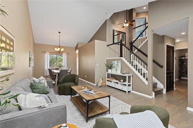 2043 Fendlebrush St, Highlands Ranch, CO 80129 - living room featuring high vaulted ceiling, a chandelier, wood finished floors, stairway, and a ceiling fan
