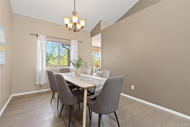 2043 Fendlebrush St, Highlands Ranch, CO 80129 - dining room with a chandelier, lofted ceiling, baseboards, and wood finished floors