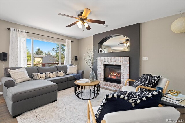 2043 Fendlebrush St, Highlands Ranch, CO 80129 - living area with ceiling fan, a fireplace, and wood finished floors