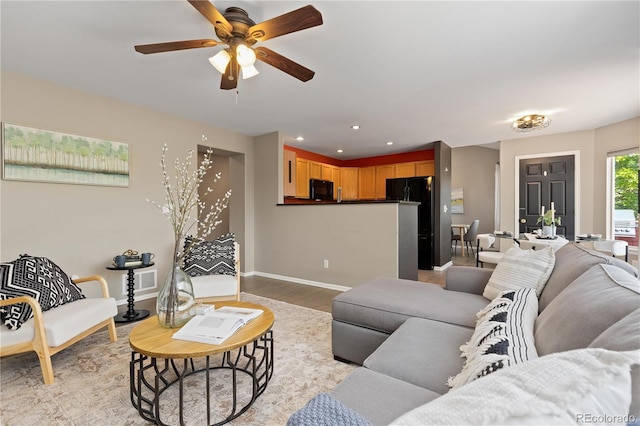 2043 Fendlebrush St, Highlands Ranch, CO 80129 - living room with ceiling fan, light wood finished floors, baseboards, and recessed lighting