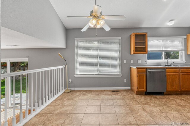 kitchen featuring dishwasher, a healthy amount of sunlight, and light tile patterned floors