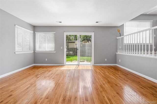 spare room with light wood-type flooring