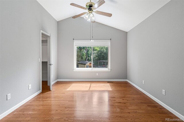 interior space featuring light wood-type flooring, vaulted ceiling, and ceiling fan