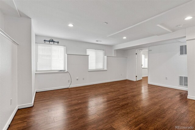 empty room featuring dark hardwood / wood-style flooring