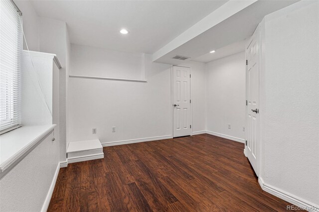 basement featuring hardwood / wood-style floors