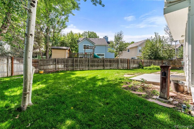 view of yard with a playground and a patio