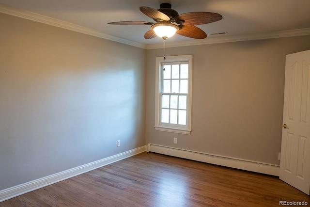 unfurnished room with a baseboard heating unit, ceiling fan, crown molding, wood finished floors, and baseboards