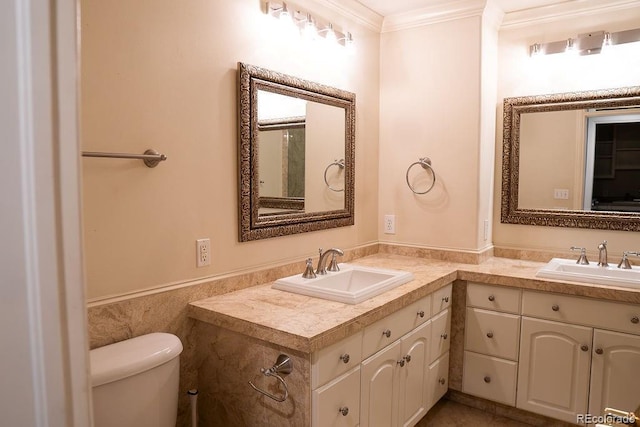 full bathroom featuring crown molding, wainscoting, vanity, toilet, and tile walls