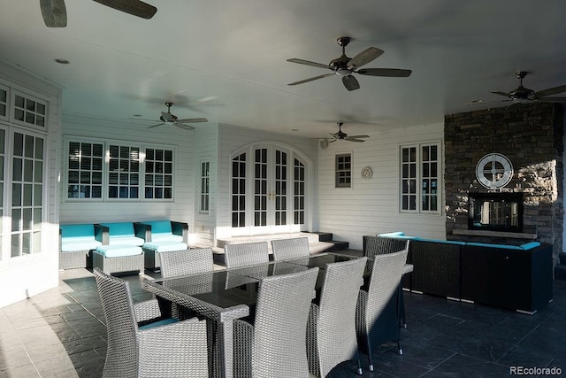 view of patio / terrace featuring a ceiling fan, outdoor lounge area, french doors, and outdoor dining space