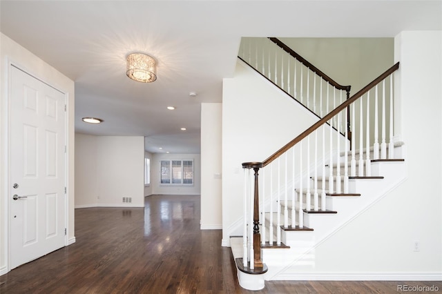 stairs with hardwood / wood-style flooring