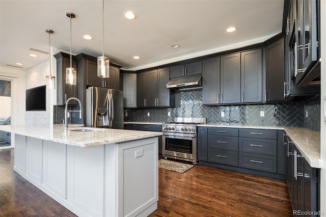 kitchen with pendant lighting, dark hardwood / wood-style flooring, light stone counters, and appliances with stainless steel finishes